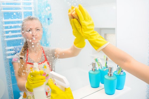 Greenwich office cleaners sanitising a modern meeting room