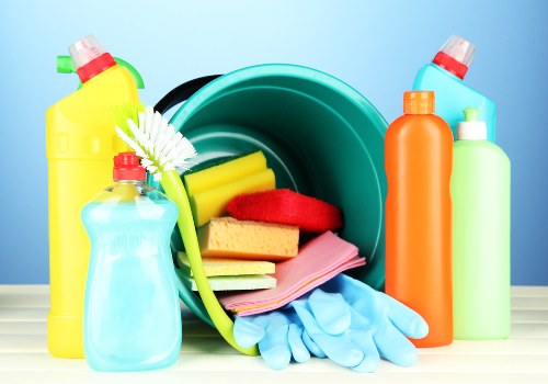 Greenwich domestic cleaner sanitising a modern kitchen surface