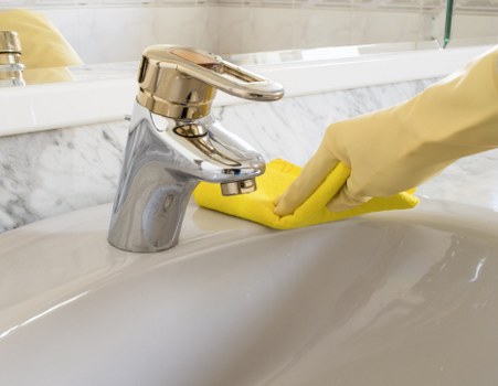 Local home cleaning service in Greenwich vacuuming a bright family room